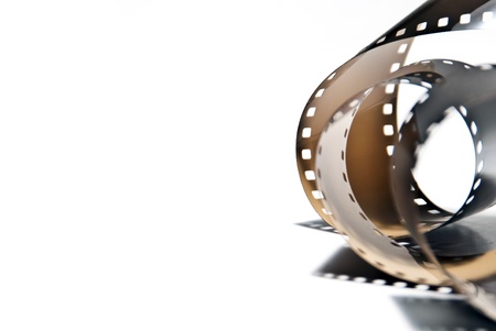a rolled out analogous photo film on white backgroundの写真素材