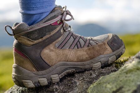 tramping boot bevore mountain landscape