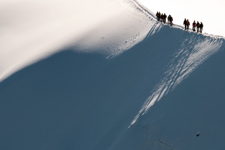 people walk on a glacier in the mountainsの写真素材