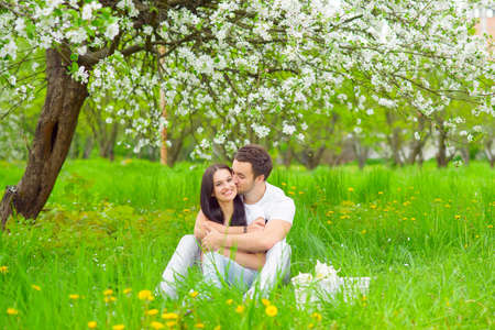 happy young couple in the gardenの写真素材