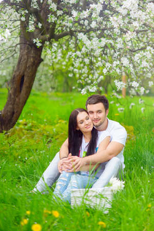 happy young couple in the gardenの写真素材