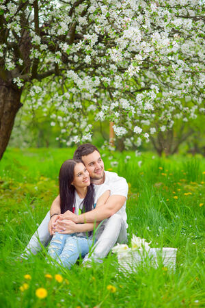 happy young couple in the gardenの写真素材