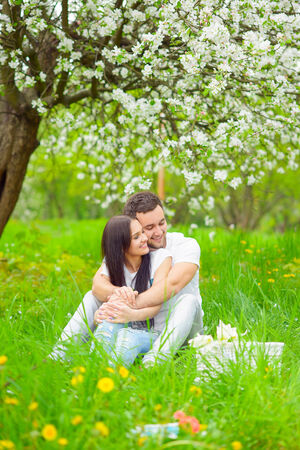 happy young couple in the gardenの写真素材
