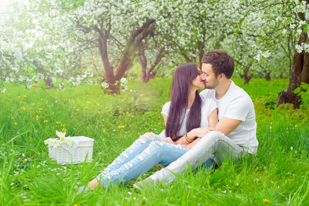 happy young couple in the gardenの写真素材