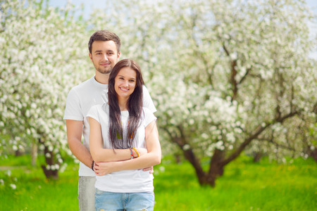 happy young couple in the gardenの写真素材