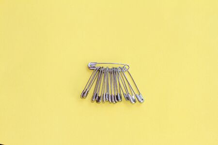 bunch or group of safety pins. Anti-hate and anti-racist symbol after the Brexit vote.の写真素材