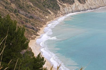 The bay near Portonovo in the province of Ancona in Italy seen from above around Monte Conero on a stormy spring day with a rough Adriatic seaの写真素材