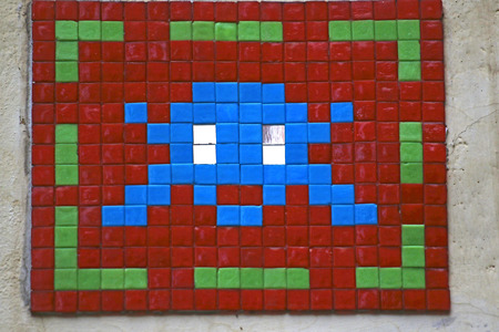 brightly coloured panel on a street in Rome with a mosaic designの写真素材
