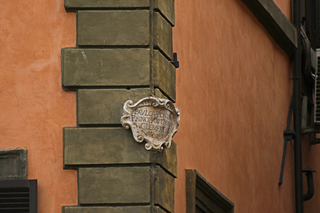 detail of an ancient plaque in Latin translated to read dedicated to Paul V or Paolo V on a wall in the streets of Rome, Italyの写真素材