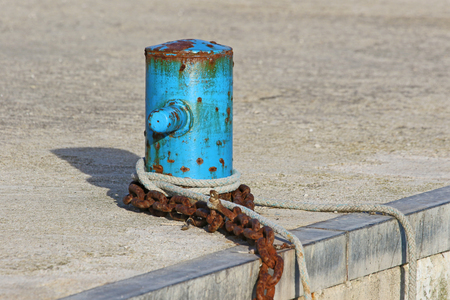 mooring post for fishing boats in the port in Numana Italy near Ancona on the Adriatic Rivieraの写真素材