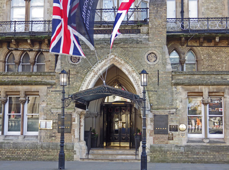 Entrance to Victorian Gothic style building of the Randolph Hotel on Beaumont Street in Oxford with flags flyingのeditorial素材