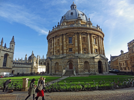 The Radcliffe Camera in Oxford designed by James Gibbs and opened in 1749 with Saint Mary's church behind, Brasenose college on the right and All Souls on the left taken in the early morningのeditorial素材