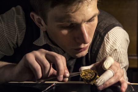 The watchmaker is repairing the mechanical watches in his workshopの写真素材