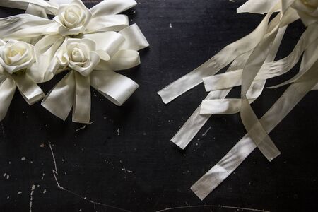 White flowers on a black background, roses