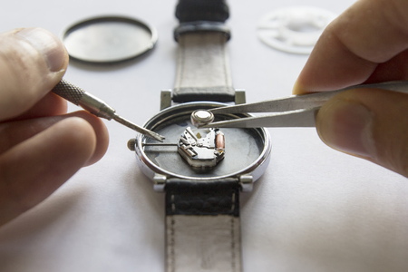 Replacing the battery in a wristwatch, watch repairの写真素材