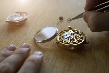 Watch maker is repairing a vintage automatic watch.の写真素材