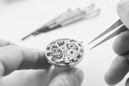 Watch maker is repairing a vintage automatic watch.