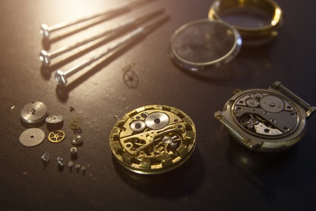 Watch maker is repairing a vintage automatic watch.の写真素材
