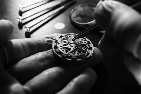 Watch maker is repairing a vintage automatic watch.の写真素材