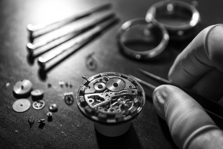 Watch maker is repairing a vintage automatic watch.の写真素材