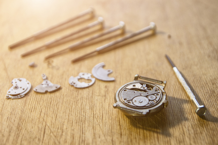 Watchmaker is repairing a vintage automatic watch.の写真素材