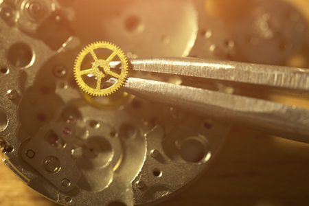 Watchmaker is repairing the mechanical watches in his workshop
