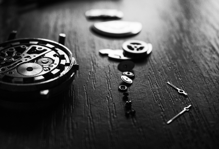 Watchmaker is repairing the mechanical watches in his workshopの写真素材