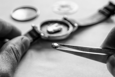 Replacing the battery in a wristwatch, watch repairの写真素材