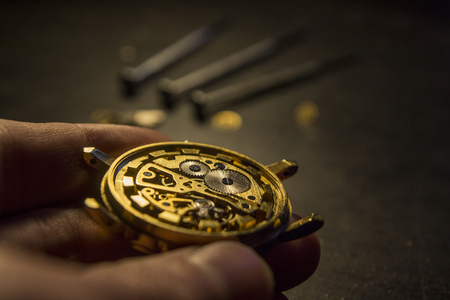 Watchmaker is repairing the mechanical watches in his workshop