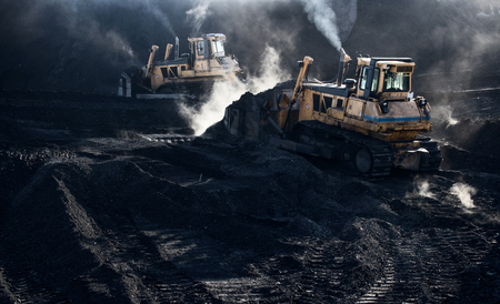 Excavators are working, dirty job, industrial, smokeの写真素材