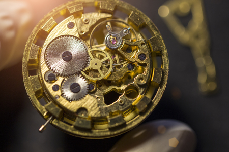 Watchmaker is repairing the mechanical watches in his workshopの写真素材