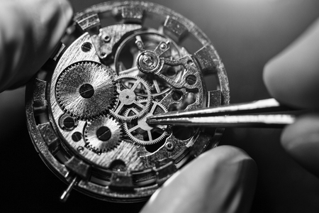 Process of installing a part on a mechanical watch, watch repairの写真素材
