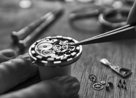 The process of installing a part on a mechanical watch, watch repairの写真素材