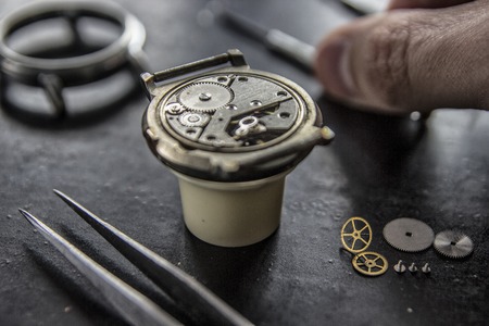 The process of installing a part on a mechanical watch, watch repair