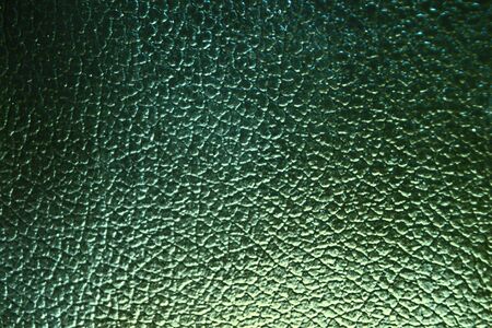Green leather backgound, dragon leather, close upの写真素材
