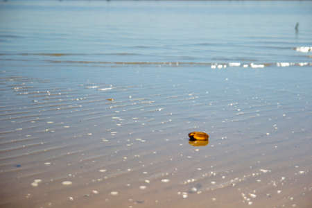 Warm summer beach, calm sea, little wavesの写真素材