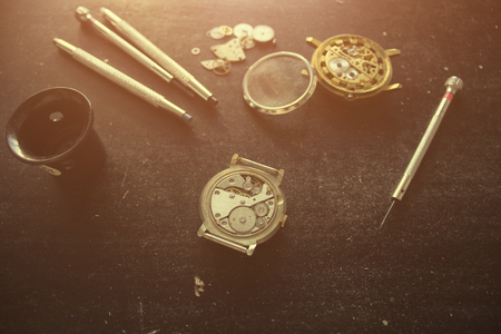 repairing the mechanical watches in his workshopの写真素材