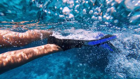 A girl is doing swimming, close upの写真素材