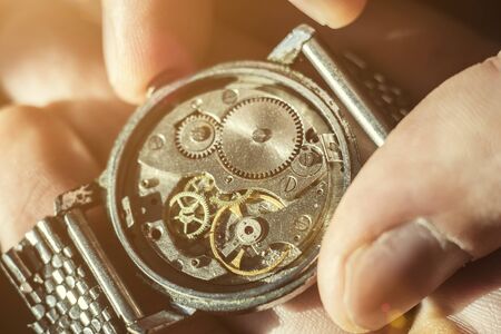 Watchmaker is repairing the wristwatch, mechanical watchの写真素材