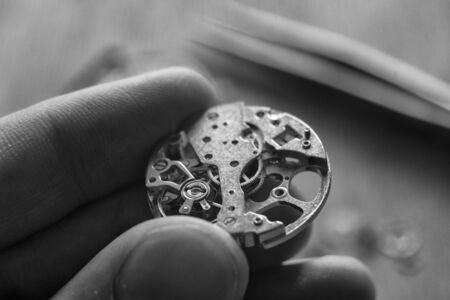 Watchmaker is repairing the wristwatch, mechanical watch
