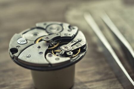 Watchmaker is repairing the wristwatch, mechanical watchの写真素材