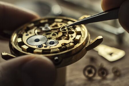 Watchmaker is repairing the wristwatch, mechanical watchの写真素材
