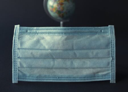 Protective mask and globe, covid 19の写真素材