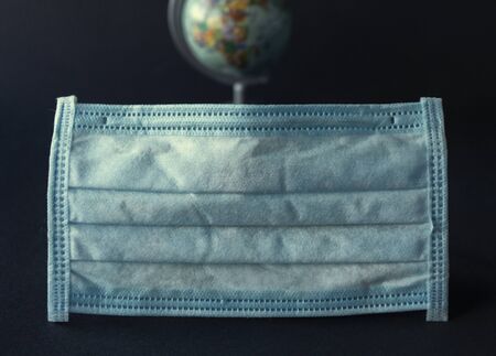 Protective mask and globe, covid 19の写真素材
