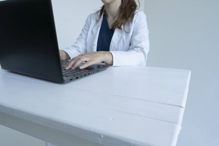 Doctor works at a computer, laptopの写真素材