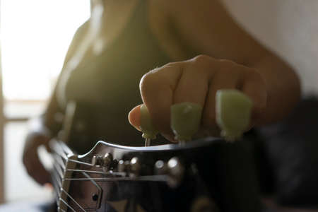 Girl learns to play the guitarの写真素材