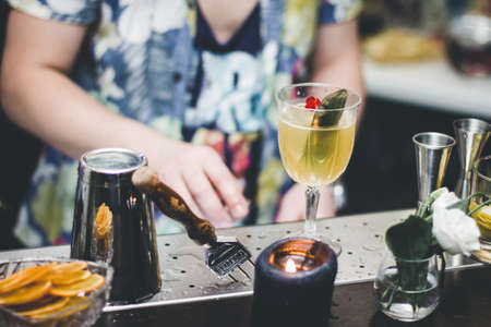 Bartender makes a cocktail, funny partyの写真素材