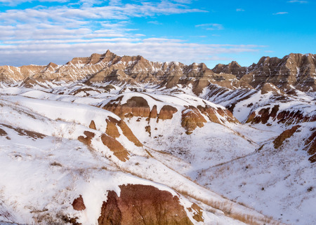 Rugged winter terrain in the Badlands National Park of South Dakota.の写真素材