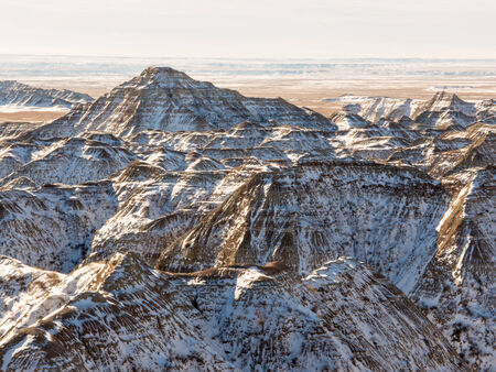 Rugged winter terrain in the Badlands National Park of South Dakota.の写真素材