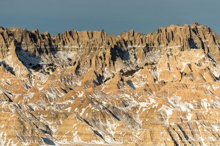 Rugged winter terrain in the Badlands National Park of South Dakota.の写真素材